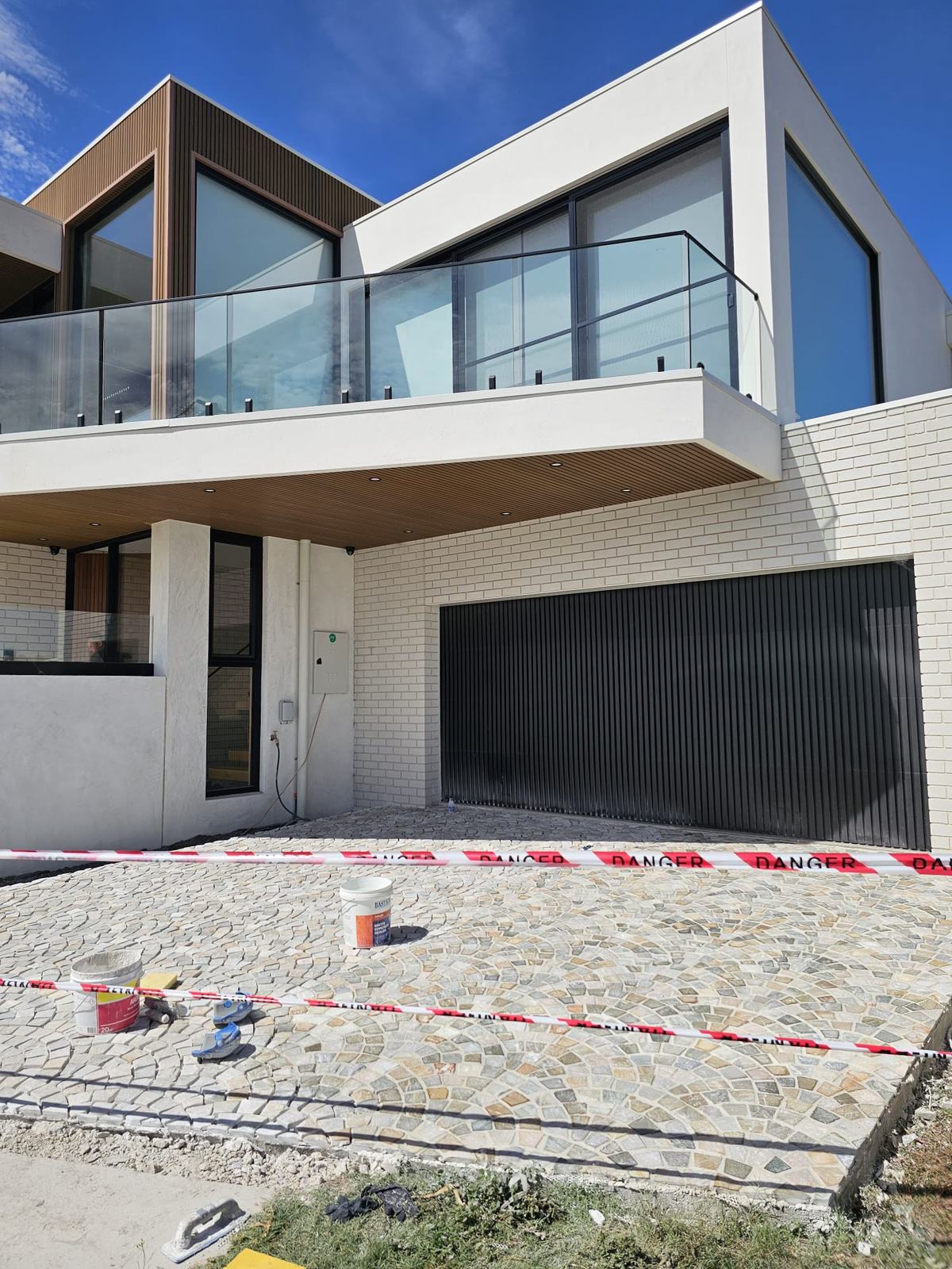 Fan-pattern cobblestone driveway at a new home in Clifton Springs